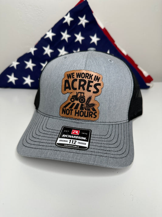 We Work in Acres Not Hours Hat